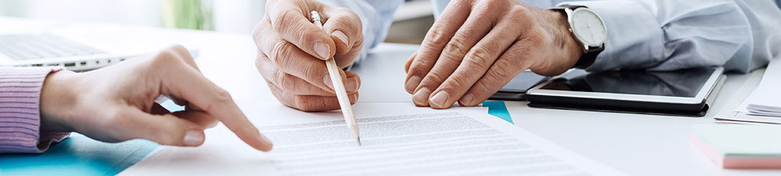 Closeup of hands doing paperwork